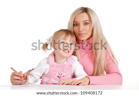 A Caucasian mama with her daughter paint crayons on a white background