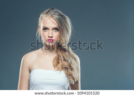 Curly blonde hair woman portrait with healthy skin