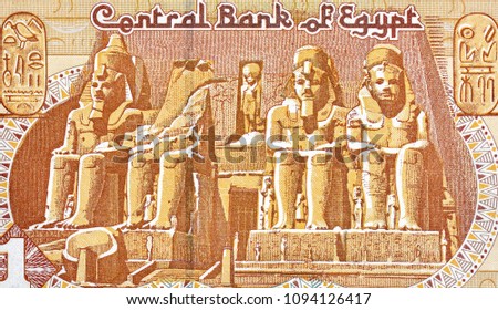 Part of the facade of Abu Simbel Temple. Portrait from Egypt 1 Pound 1996 Banknote. A Ramses II in front of the Luxor Temple of Amenophis II. Egypt money. 
