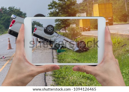 Insurance agent photographing car damage for claim form, The accident occurred in the car because the driver of the car. Car insurance survivor guilt.
