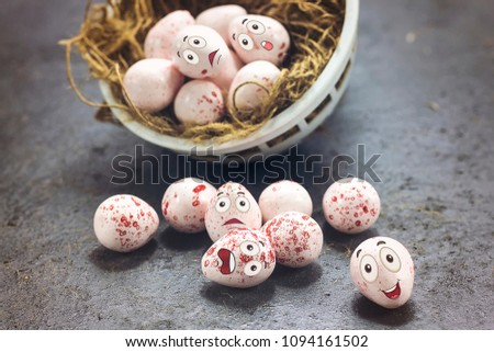delicious pink chocolate easter eggs with funny cartoon face on nest, happy easter eggs concept