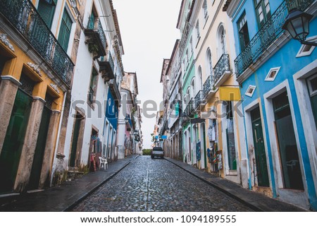 Pelourinho ("Pillory"), is a historic neighborhood in western Salvador, Bahia, Brazil. It was the city's center during the Portuguese colonial period. There are some tourists looking the architecture.