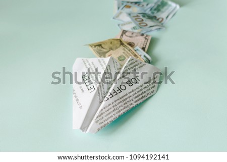 Job offer letter and a cash flow. A paper plane symbolizes receiving good news about finding a job.