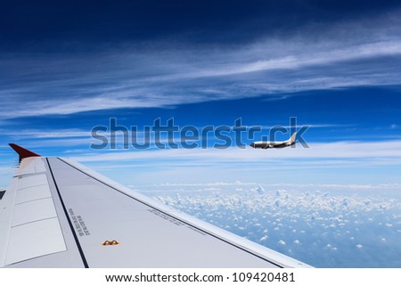 aircraft on the clouds with the blue sky Royalty-Free Stock Photo #109420481
