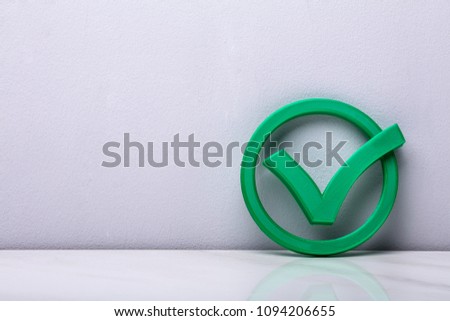 3d Green Check Mark Icon In Front Of Wall