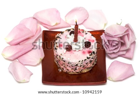 cake with candle and pink rose