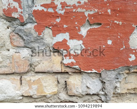 background texture from brick wall with cracked plaster