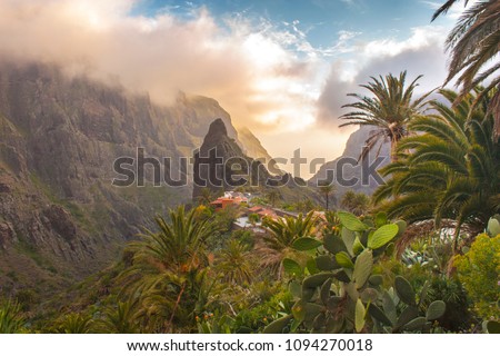 Stunning landscape mountain village in  deep canyon with jungle forest on a paradise island. Beautiful golden hour sunrise sunset soft light. Travel photo, postcard. Masca, Tenerife, Canary Islands Royalty-Free Stock Photo #1094270018