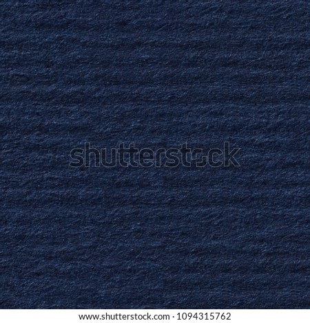 Easy corrugated paper texture in dark blue colour. Seamless square background, tile ready. High resolution photo.