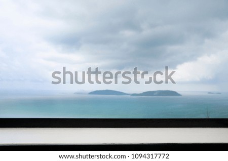 Empty white top surface with black edging of drinking counter bar terrace on sea scape view island background