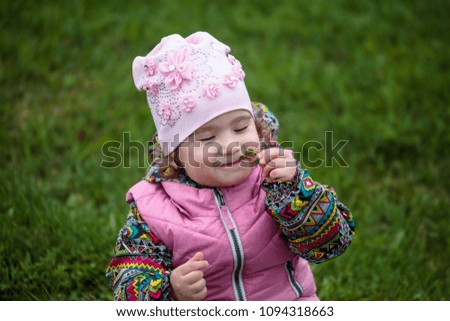 cute and little positive child on the street