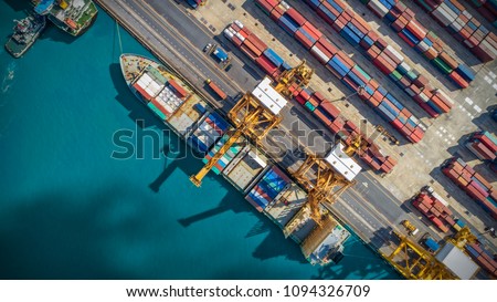 Logistics and transportation of Container Cargo ship and Cargo plane with working crane bridge in shipyard, logistic import export and transport industry background Royalty-Free Stock Photo #1094326709