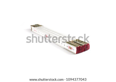 Folding rule measuring tool isolated on white background Royalty-Free Stock Photo #1094377043