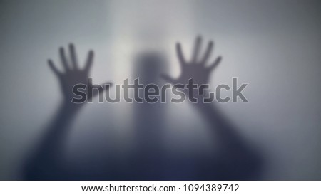 Silhouette of mentally ill person trying get out of ward, specializing hospital