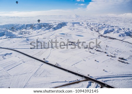 Snowscape or snow landscape and ballooning with vivid blud sky via bird-eye-view