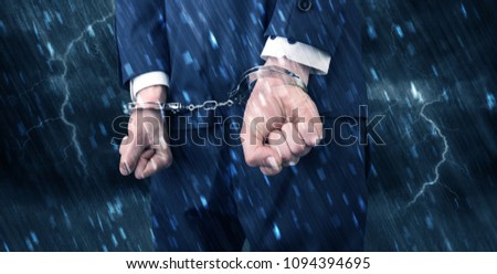 Stormy bad day concept with close handcuffed elegant man