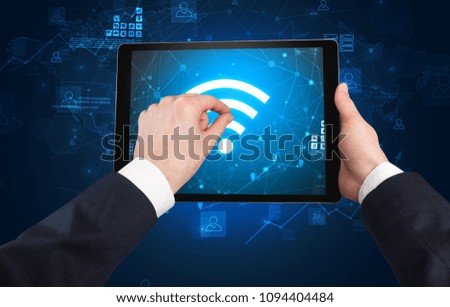 Elegant hand using tablet with online office kit concept