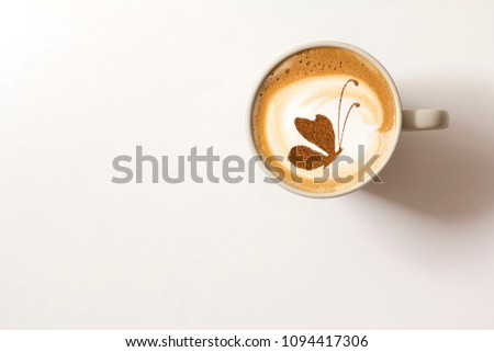 coffee with a picture of a butterfly from cinnamon