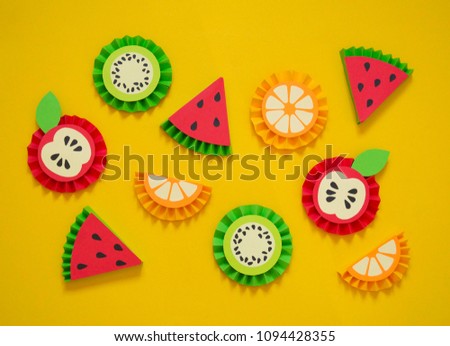Fruit made of paper. Yellow background. There's room for writing.Tropics. Flat lay.