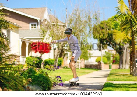 Skater wear VR glasses. Millennial generation lifestyle, sport. Skateboarding in the future. Argumentative reality in the real world. Los Angeles in the future.  Royalty-Free Stock Photo #1094439569