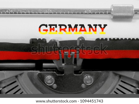 Germany with national colors flag text written by an old typewriter