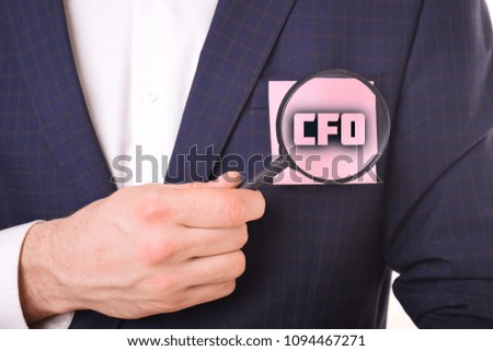 A businessman shows an inscription:CFO