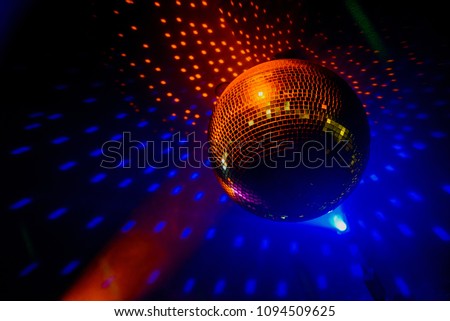 color lighting disco mirror ball in dark room
