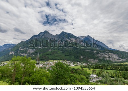 View of the Alps in Liechtenstein. Snowy mountain peaks in the mountains. 