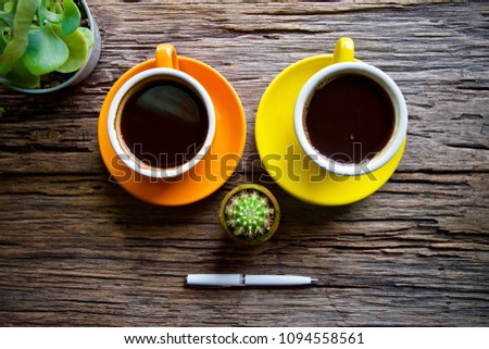 Coffee cup hot and notebook pen laptop on wooden table desk