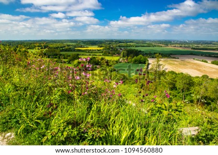 A bright beautiful day in May and a walk from the village of Wye in Kent up the north downs with amazing views of the countryside Royalty-Free Stock Photo #1094560880