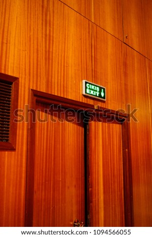 Wooden Exit Door at Theatre with Exit Sign  on it