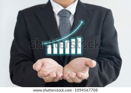 Business man is action for taking care of stock market result as in business concept.