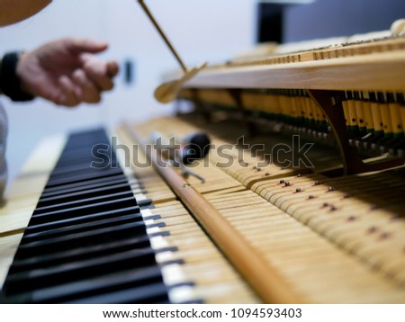 Grand piano mechanism include hammers, keys and adjusting buttons with smooth light and depth of field,high details.