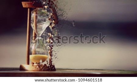 Dispension Hourglass timeout on wooden table with blurred background landscape.