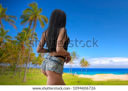 girl at the sea in a bathing suit at sunset