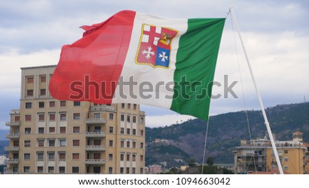 Flag of Italy against the background of the ancient cathedral. Stock. Italian flag in the wind develops