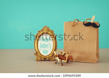 Image of shopping bag, present for dad. Father's day concept
