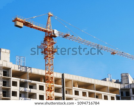 Crane over construction site. Crane near building.