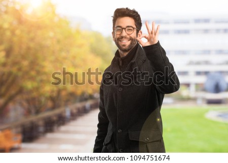 young man doing ok gesture