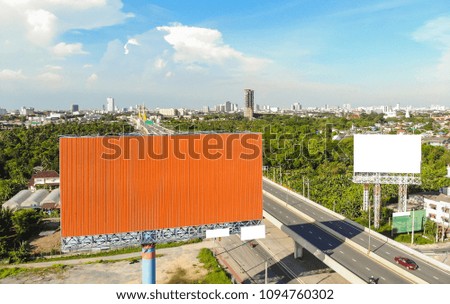 Orange billboard with blue sky and clouds background.copy space.
