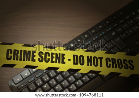 Computer Keyboard with do not cross crime scene tape