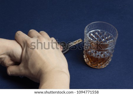 Alcohol and car keys, hands, ban, female hand holds a man's hand
