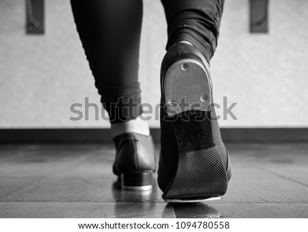 Black and white version of Walking in tap shoes in tap class