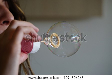 Bubble maker create bubbles candid image close up view