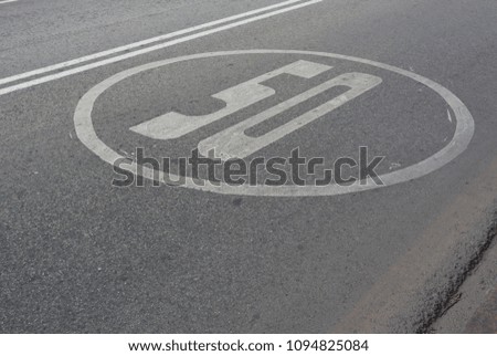 Spain. Malaga. Photo of road marking with figure 50 in circle
