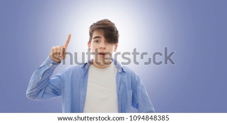 child with raised finger and question expression