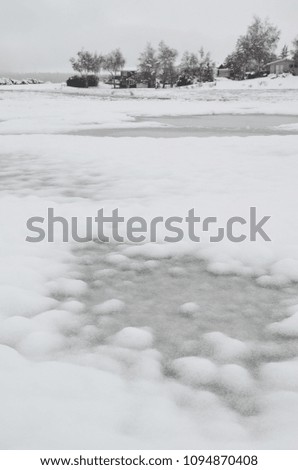 Frozen water during winter snow fall.
