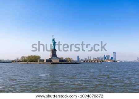 The Statue of Liberty in New York City against the blue sky
