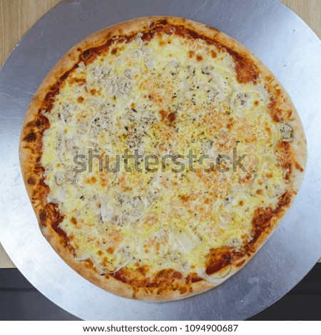 Pizza delicious classic style on wooden table background. Fresh food variety, closeup top view promotional photo. Italian traditional culture