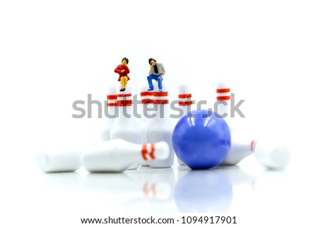 Miniature people : businessman and friend sitting with bowling pin  ball,Business relax playing concept.